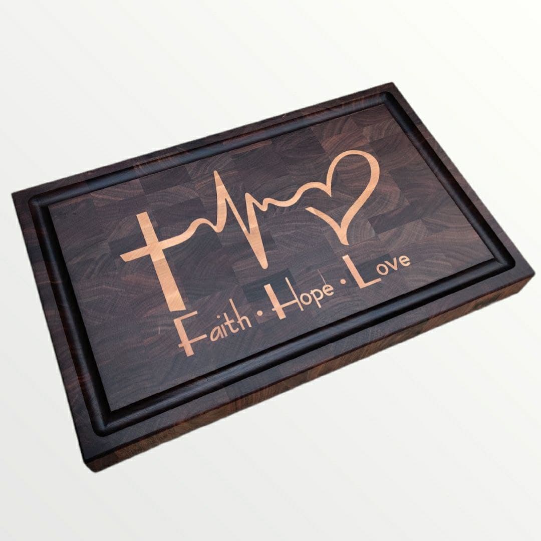 Decorative wooden board with Faith Hope Love maple inlay text and cross and heart design on carving board