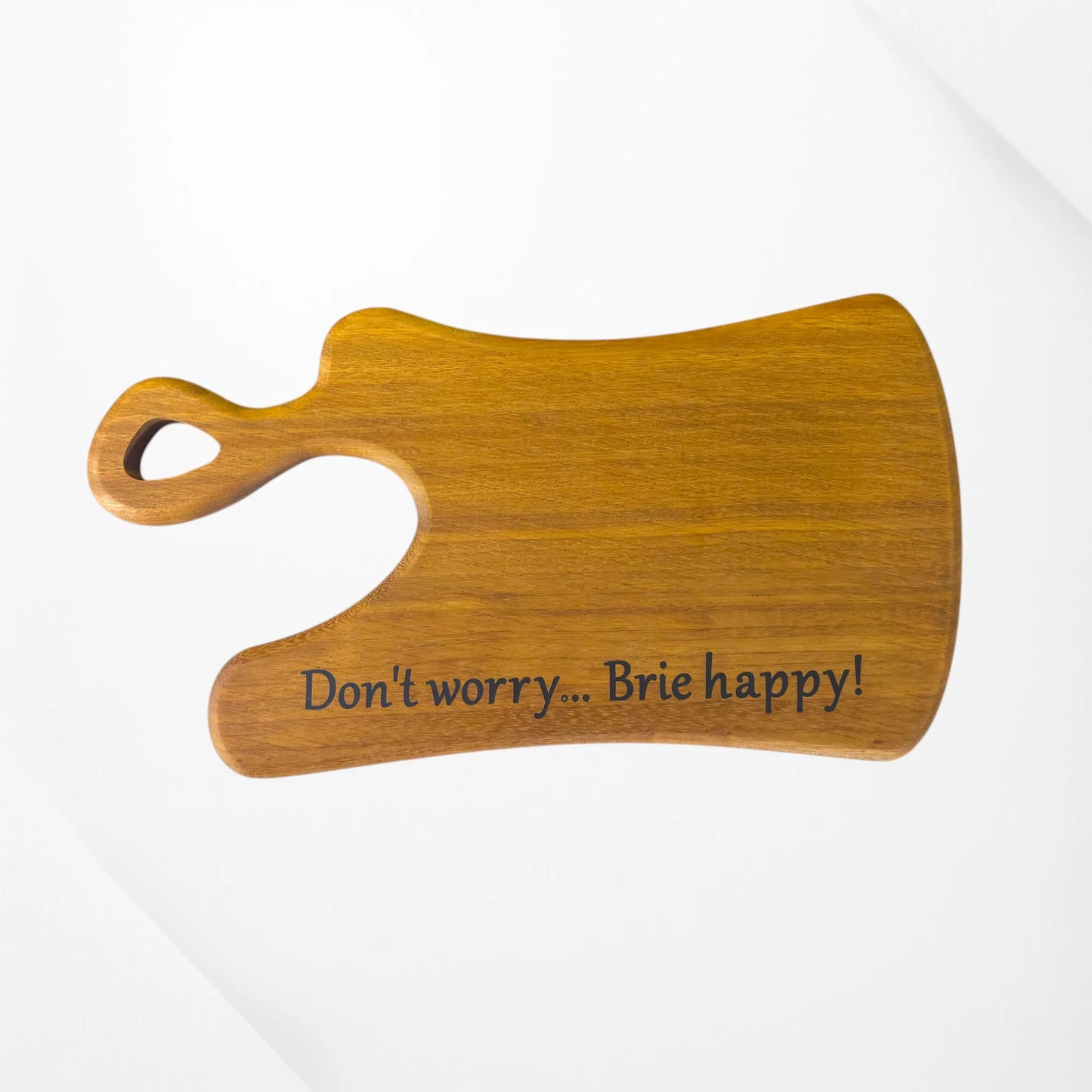 Indulge in a smile every snack time with our handcrafted cheese board, engraved with “Don’t worry… Brie happy!” Made from premium hardwood, it’s the perfect quirky gift for cheese lovers and entertainers. Personalisation available—add a playful touch to your kitchen or dining table