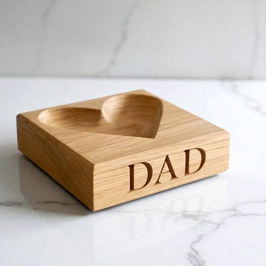 Engraved wooden catch-all tray with space for items neatly placed inside