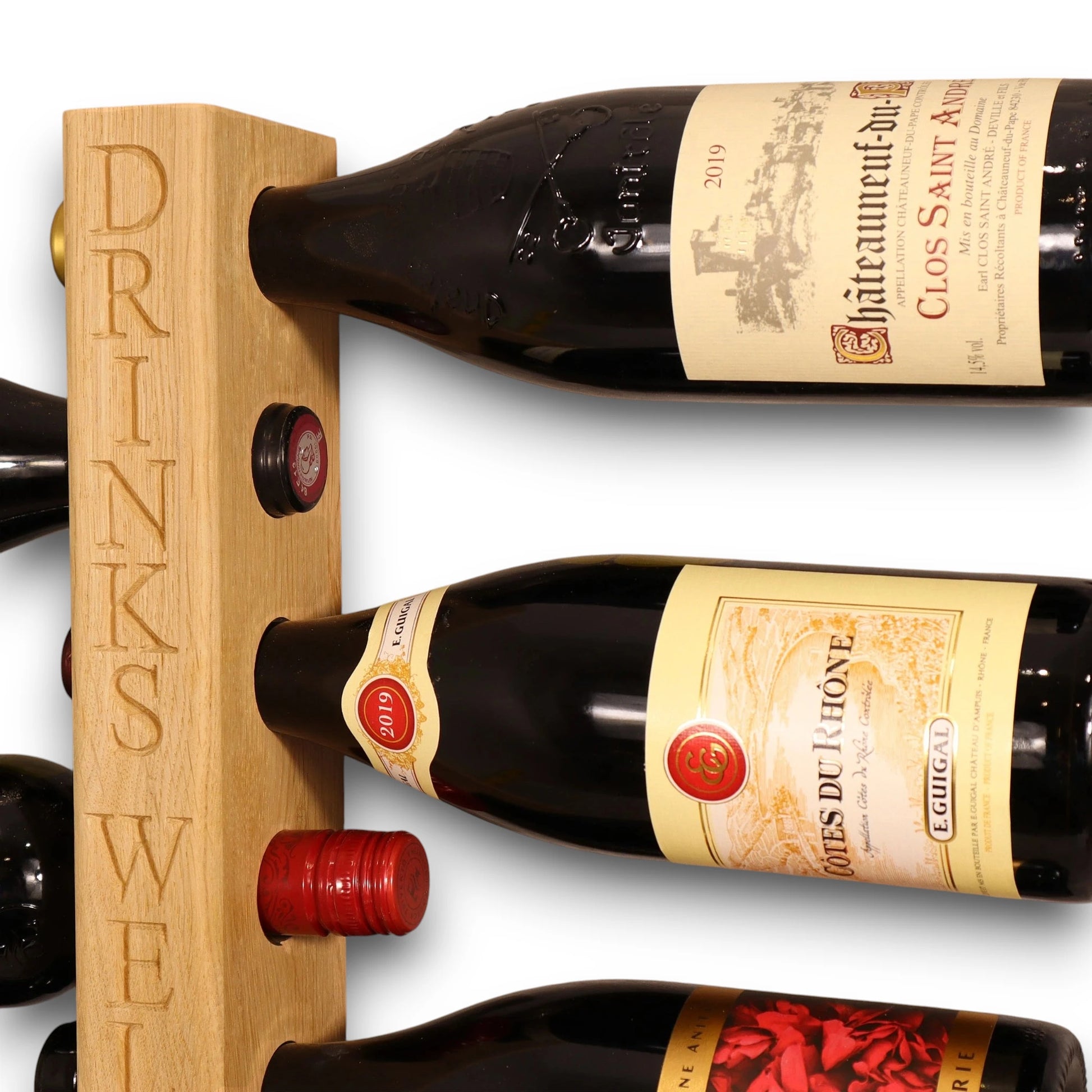 Close-up of personalised vertical engraving on oak wine rack, showcasing smooth English oak grain and custom carved lettering