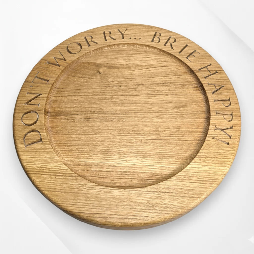 Engraved oak cheese board with quote ‘Don’t worry, brie happy’ – handmade solid oak serving board by The Crafty Oak