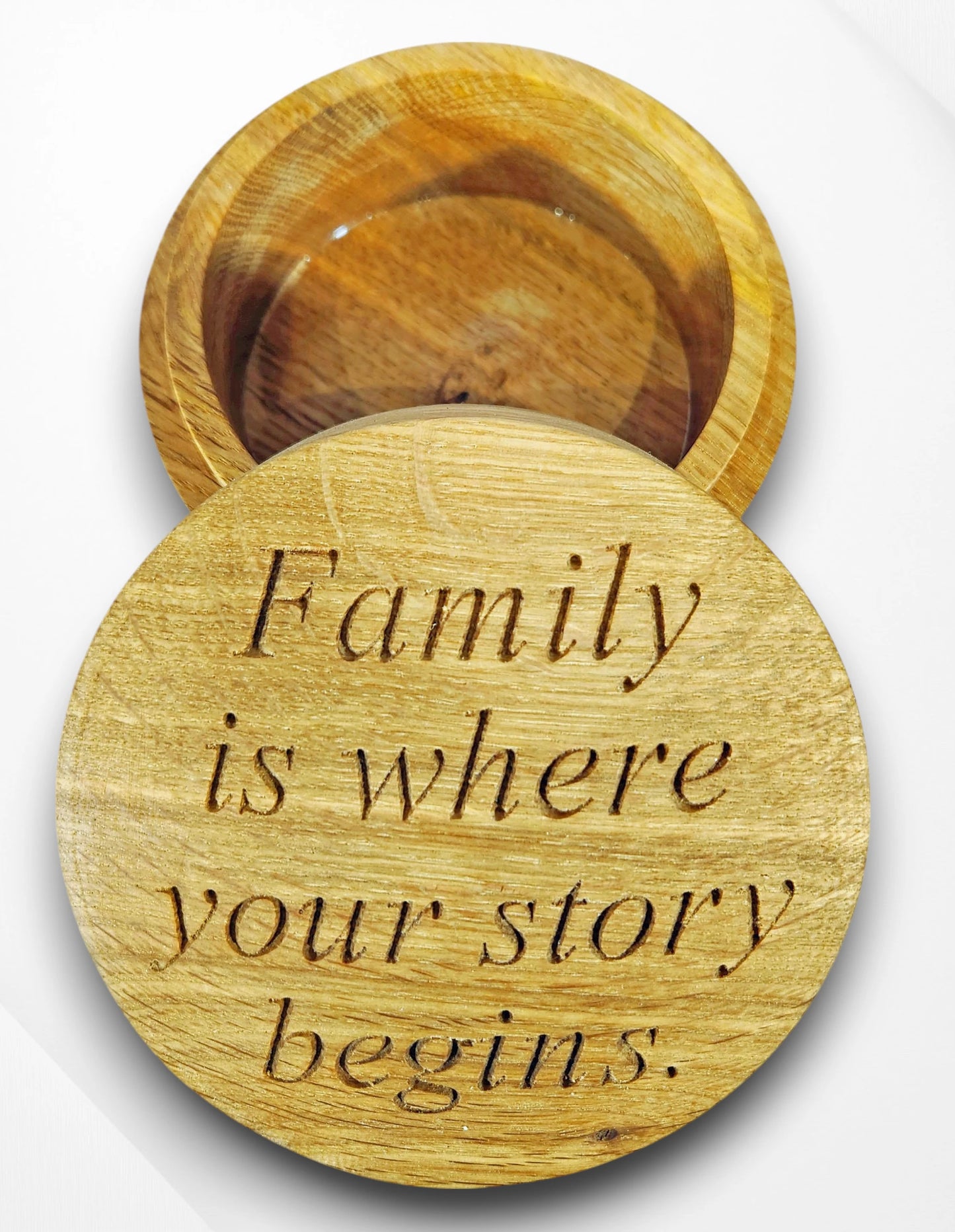 Handcrafted round oak trinket box engraved with the quote “Family is where your story begins” — personalised wooden keepsake gift celebrating love, home, and family.