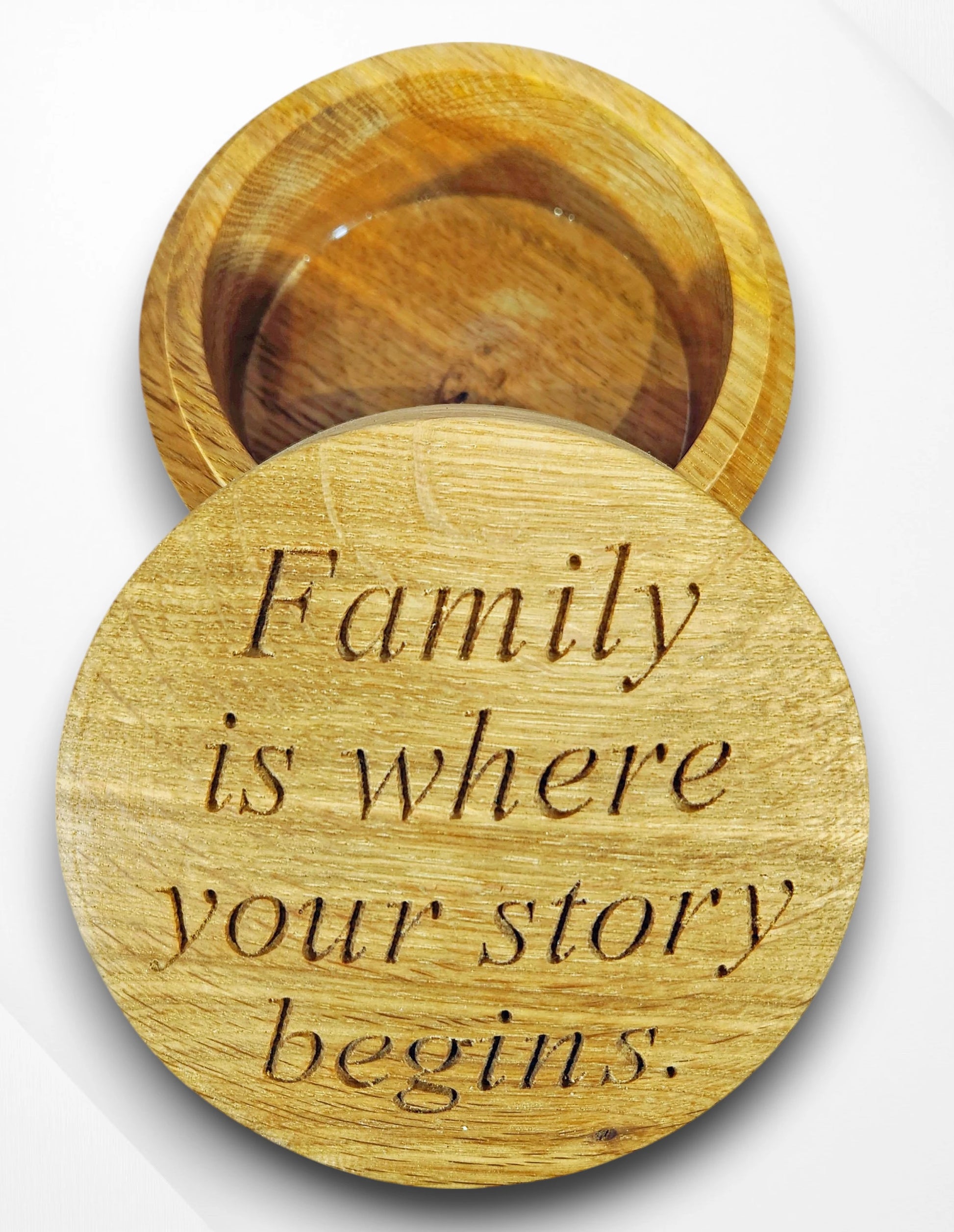 Handcrafted round oak trinket box engraved with the quote “Family is where your story begins” — personalised wooden keepsake gift celebrating love, home, and family.