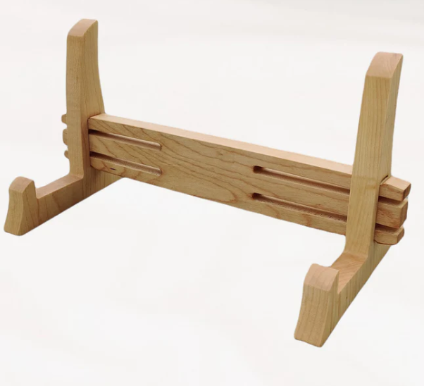 Handcrafted oak carving board holder with interlocking joints and natural wood grain — elegant stand for presenting or drying chopping and carving boards.
