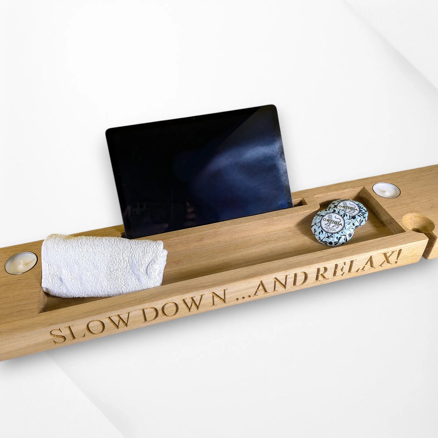 Angled shot of oak bath tray showing engraved side message and craftsmanship detail.