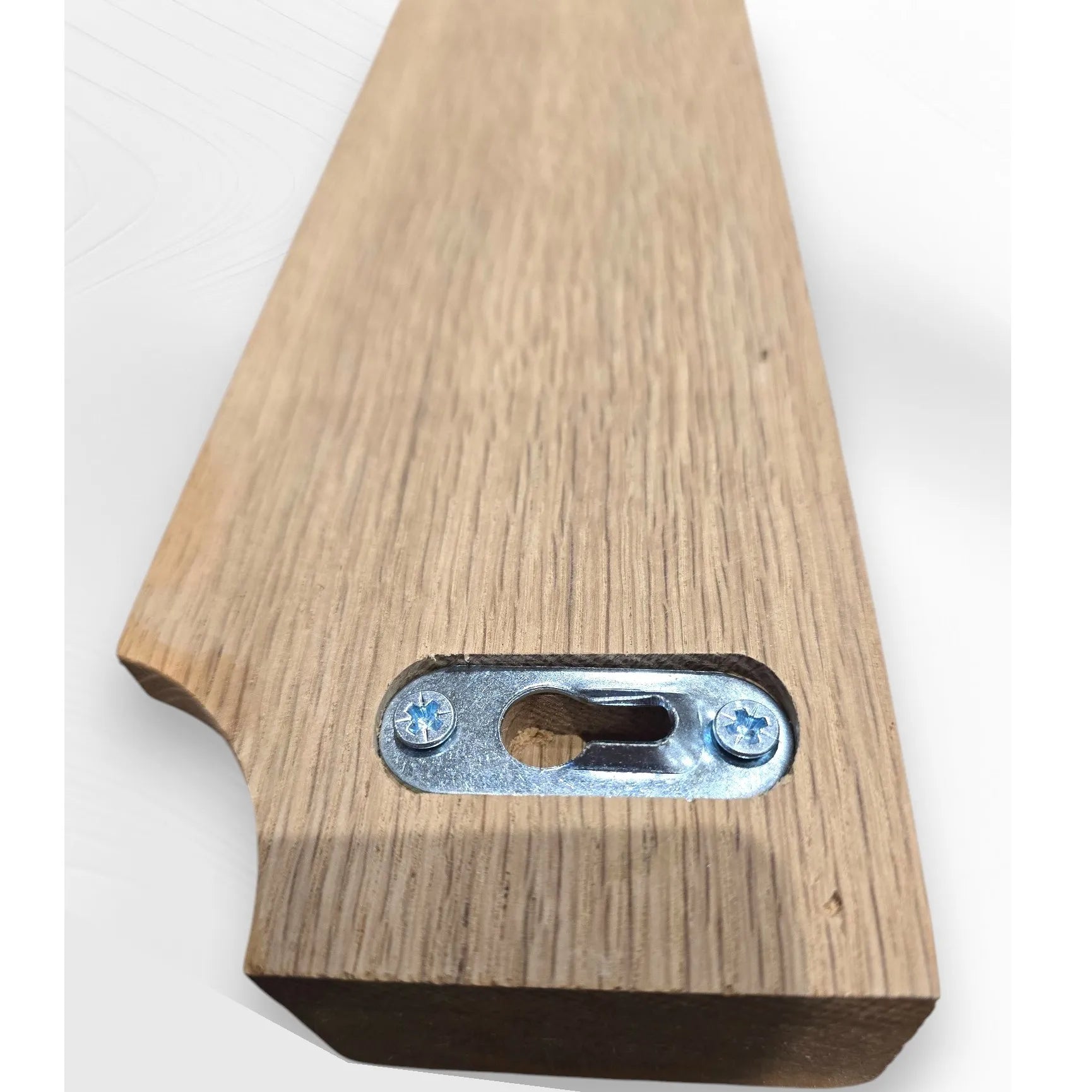 Close-up of rear keyhole mount on oak Gravity Track, showing secure wall fixing detail. Handmade wooden photo and paper holder by The Crafty Oak.