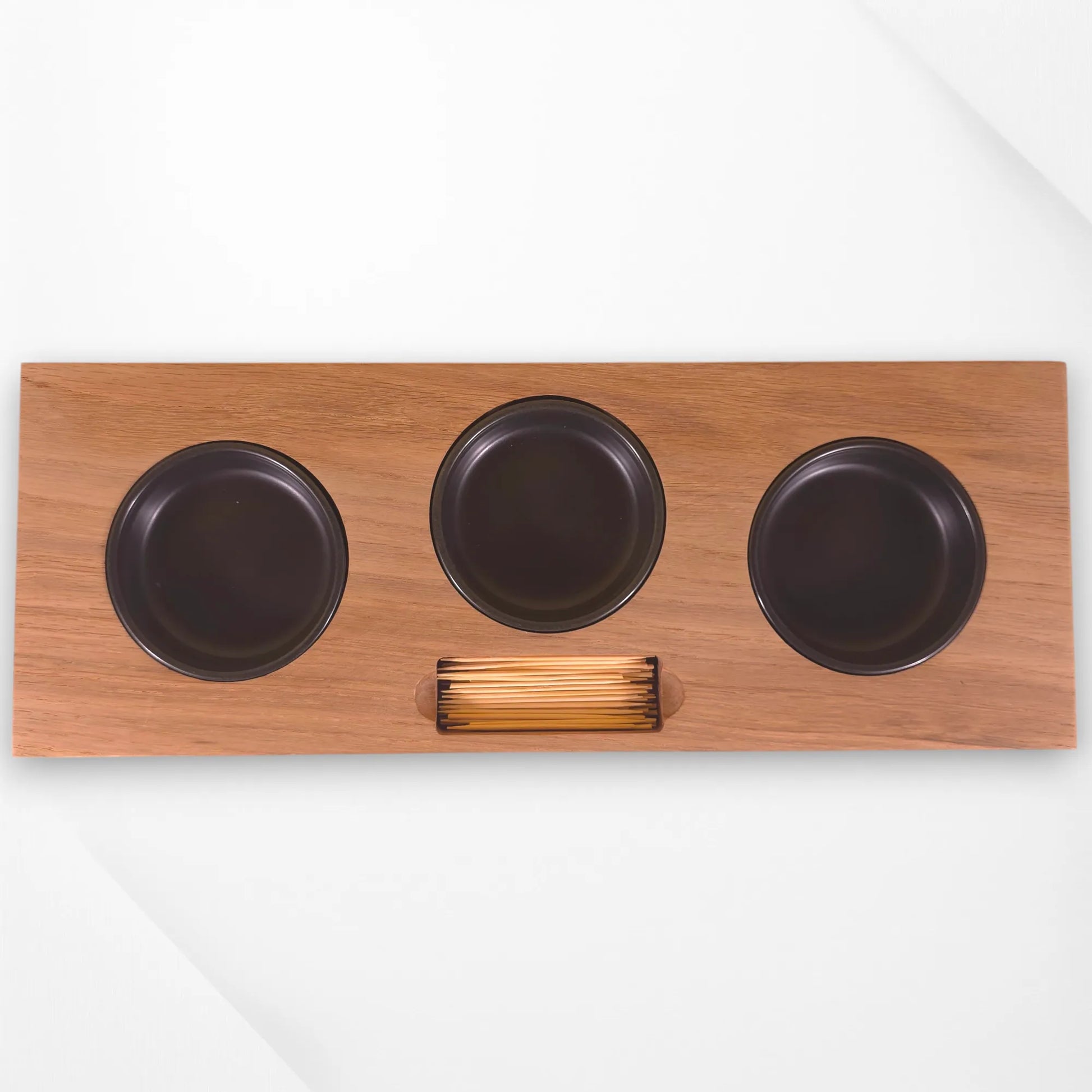 Top-down view of oak serving tray with three metal bowls and a built-in cocktail stick holder. Handmade wooden appetiser tray by The Crafty Oak.