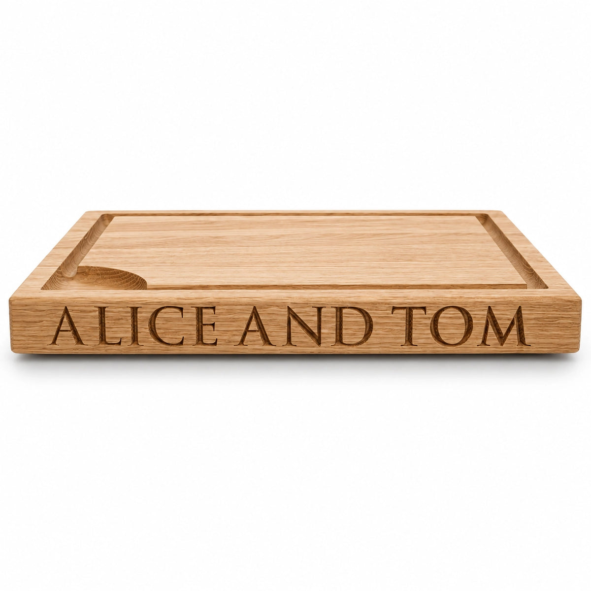 Personalised solid oak chopping board engraved with Alice and Tom
