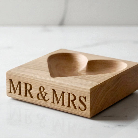 Personalised solid oak heart-shaped bowl with “MR & MRS” engraved on the front, perfect as a romantic keepsake or wedding gift. Handcrafted with a smooth finish, ideal for jewellery, rings, or small trinkets.