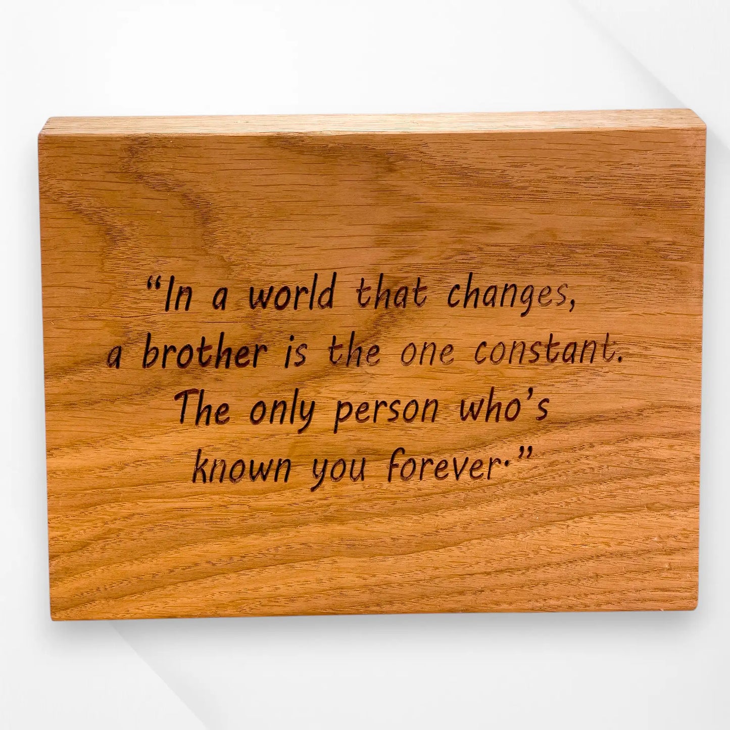 Engraved oak phone tray message from one brother to another — personalised wooden gift featuring heartfelt quote “In a world that changes, a brother is the one constant,” handcrafted keepsake for birthdays or special occasions.