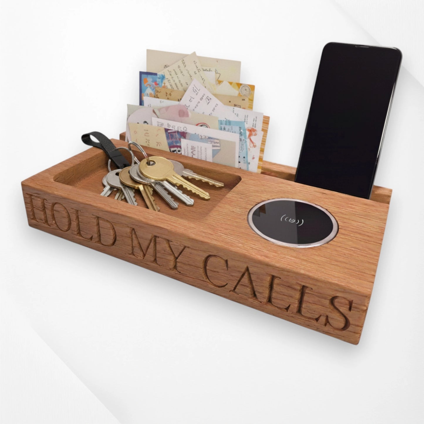 Personalised oak wireless charger tray engraved with ‘Hold My Calls,’ featuring phone stand, key holder, and letter organiser—handmade wooden desk and bedside organiser from The Crafty Oak.