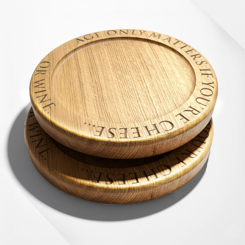 Stacked engraved oak cheese boards with quote ‘Age only matters if you’re cheese or wine’ – handmade solid oak boards by The Crafty Oak